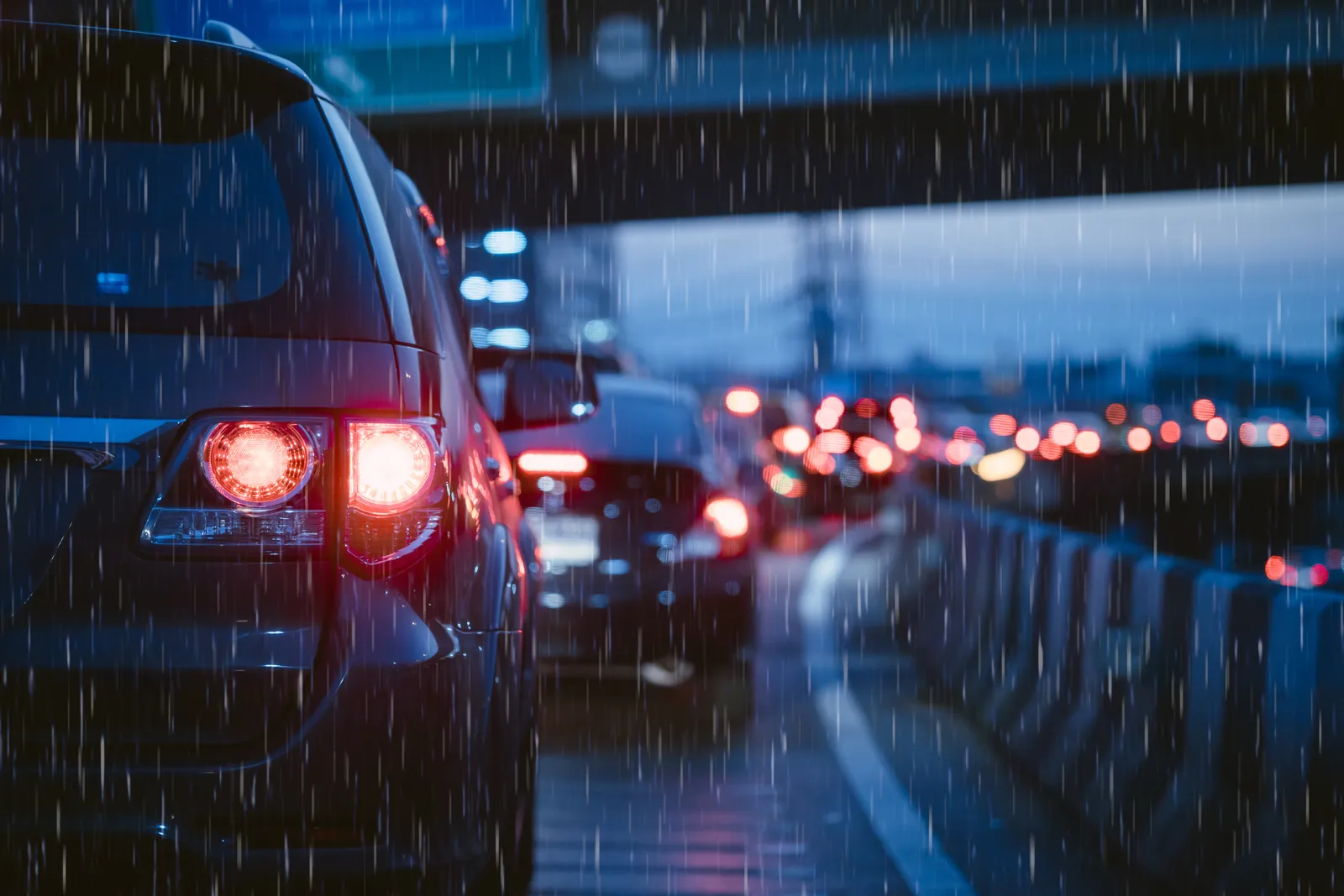 Cars in rainy evening traffic on a Washington highway, the setting for many auto injury claims