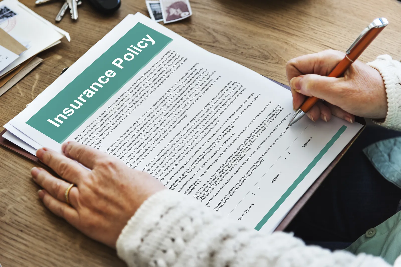 Attorney reviewing an insurance policy document during a policy limit investigation